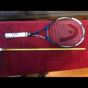 New tennis racquet comes with tennis balls.